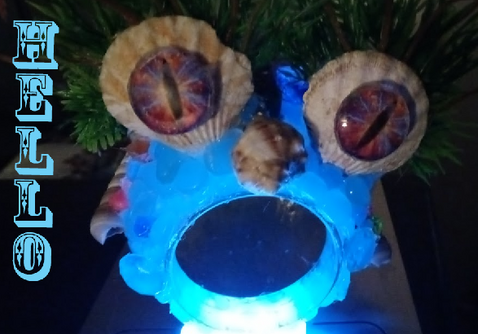 one of my newest Aqua Creatures with the digital scale light up his mouth like kids do to tell ghost stories. very strange bulbous eyes broken up shell nose glowing blue mouth says hello. you do not want to say hello back trust me ive met him.